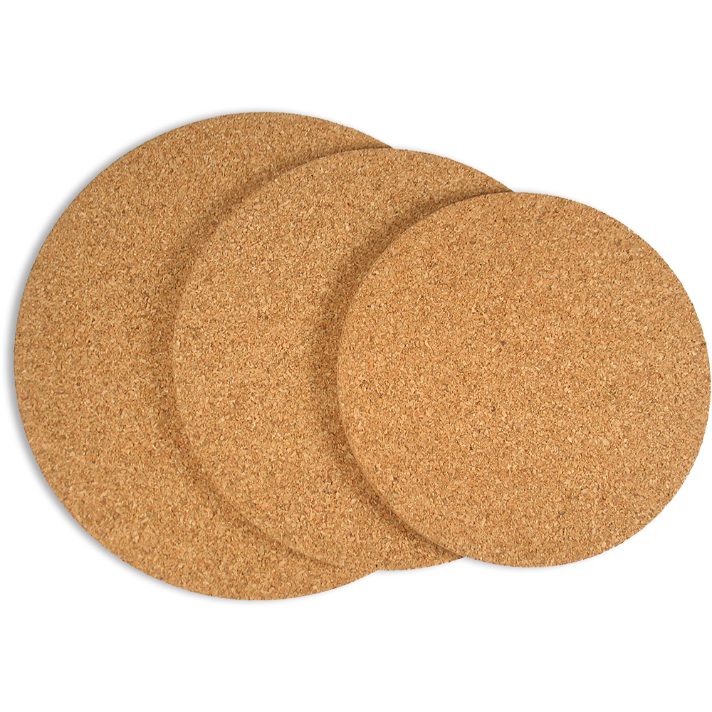 Three round cork coasters overlapping on a white background