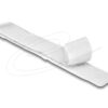 White adhesive bandage (Band-Aid) laid diagonally on a white background with subtle shadows and decorative swirls nearby.