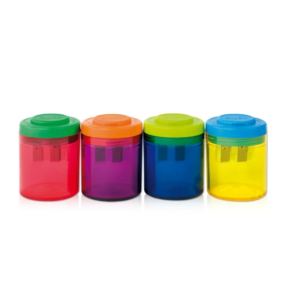 Row of four colorful, translucent plastic jars with matching colored lids (green, orange, lime, blue) from left to right. They appear empty and are lined up on a white surface.